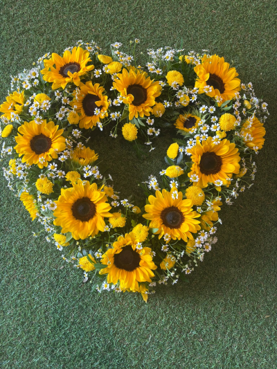 Sunshine Memories - A vibrant heart-shaped tribute filled with warm, cheerful colours, celebrating a life remembered with love and happiness.